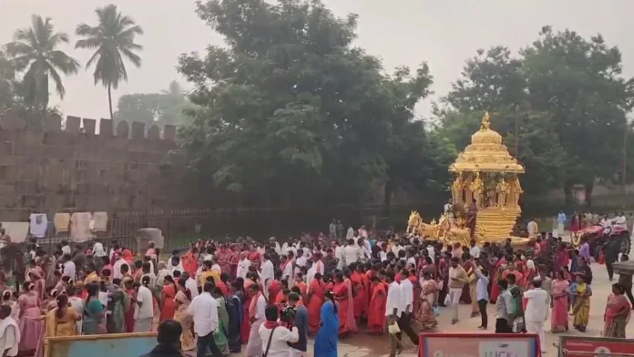 Adi couple's procession on golden chariot..